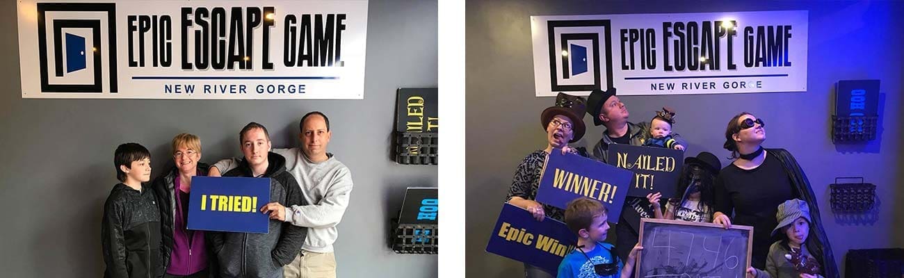 A family poses with "I tried" signs next to a fmaily group holding "Winner" signs at Epic Escape Game New River Gorge.