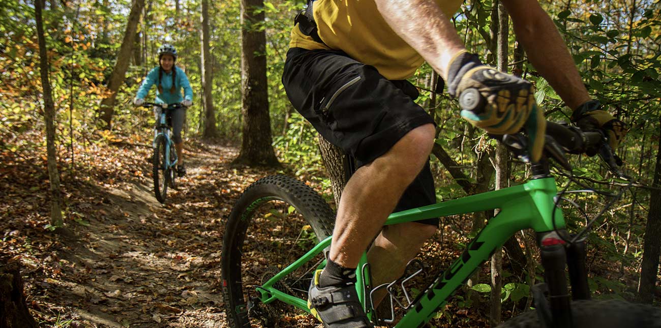 Mountain bikers ride single track trails on a guided bike tour at Arrowhead Trails in Fayetteville, West Virginia.