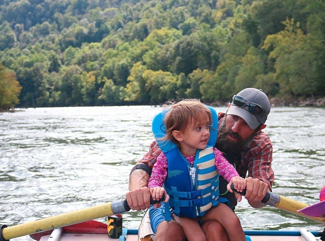 Father takes his daughter rafting on the Upper New