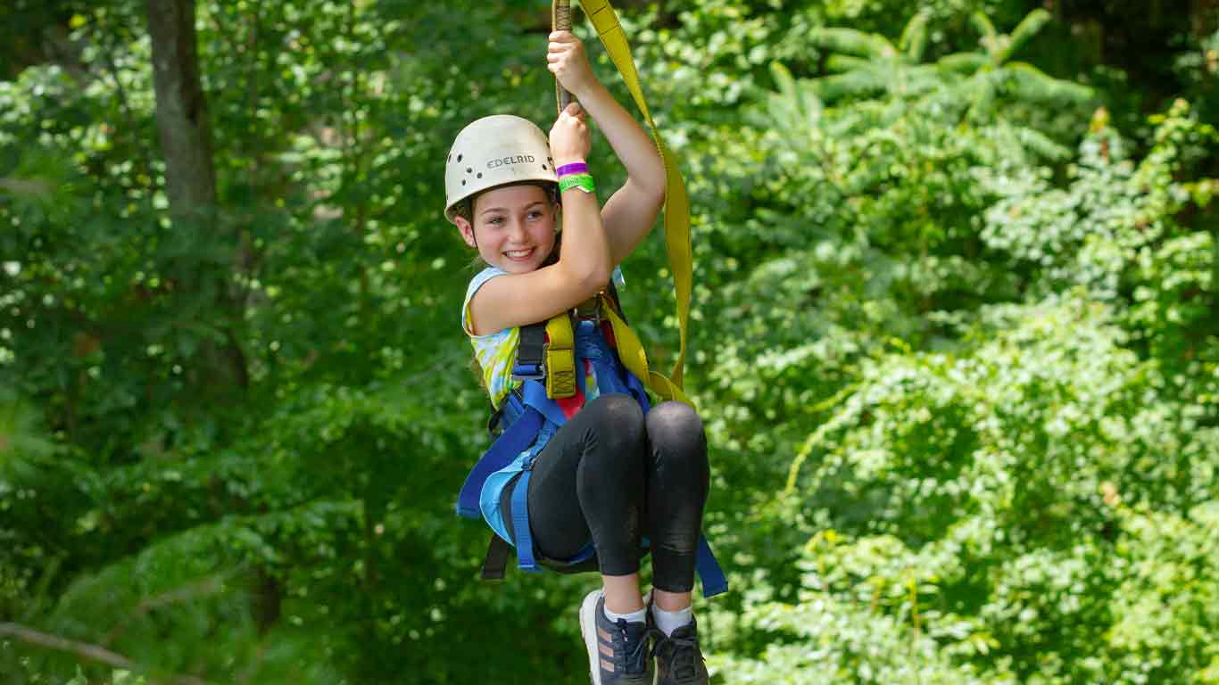 Girl enjoying a ziplining trip at ACE Adventure Resort