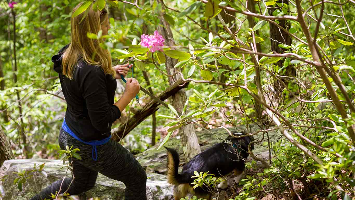 Woman enjoying a hike at ACE Adventure Resort for boots and boats overnight package