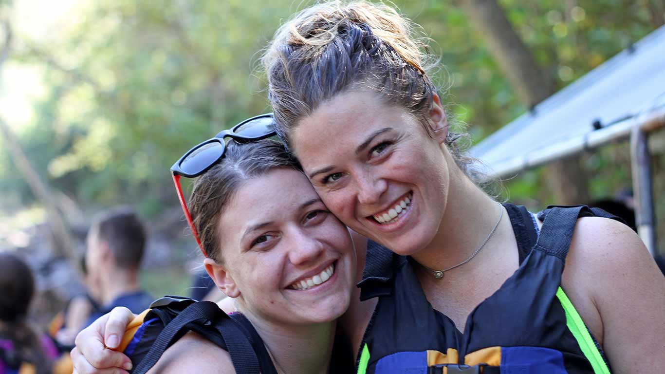 Two paddlers smiling and posing together