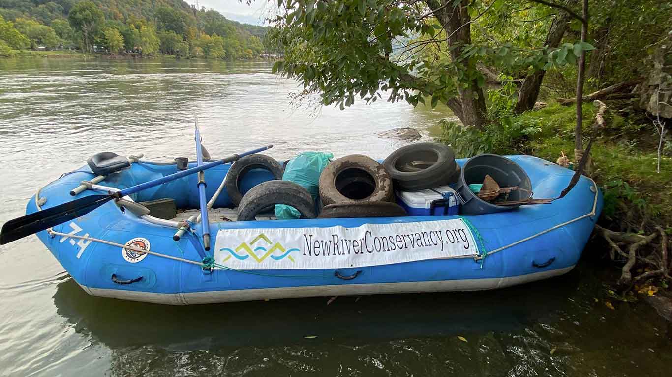 River clean up with tires in a raft