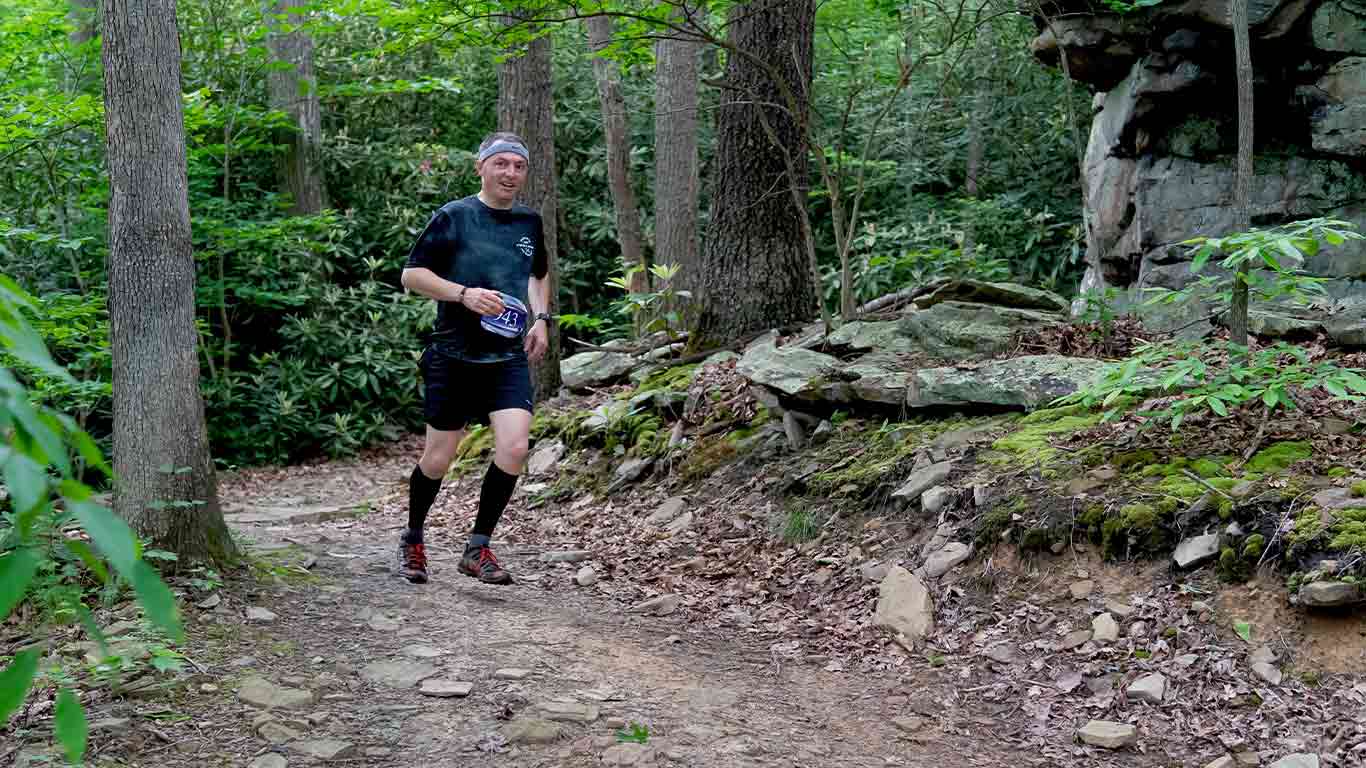 Trail runner on a trail at ACE Adventure Resort