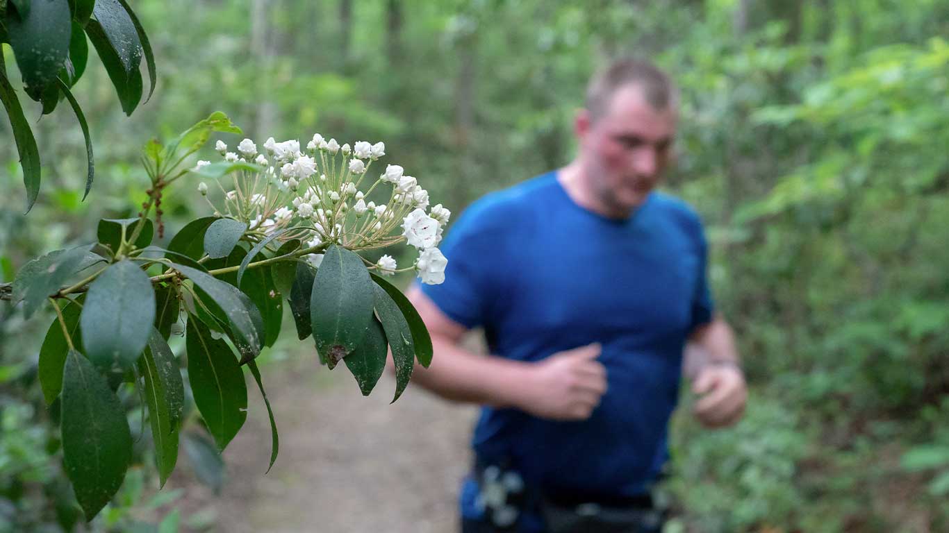 Runner with close up of flower