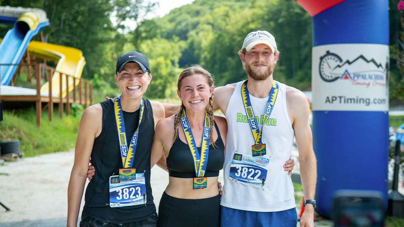 Group of runners posing for camera