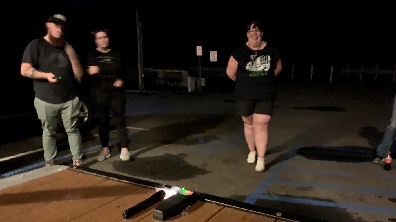 Group ghosting hunting with a flash light