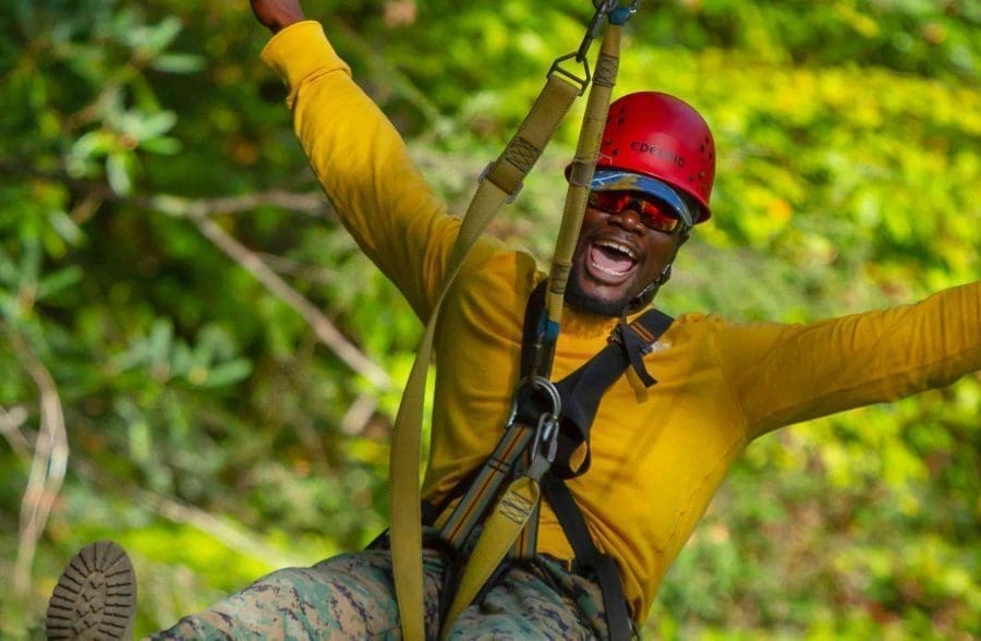 Man smiling on zipline tour