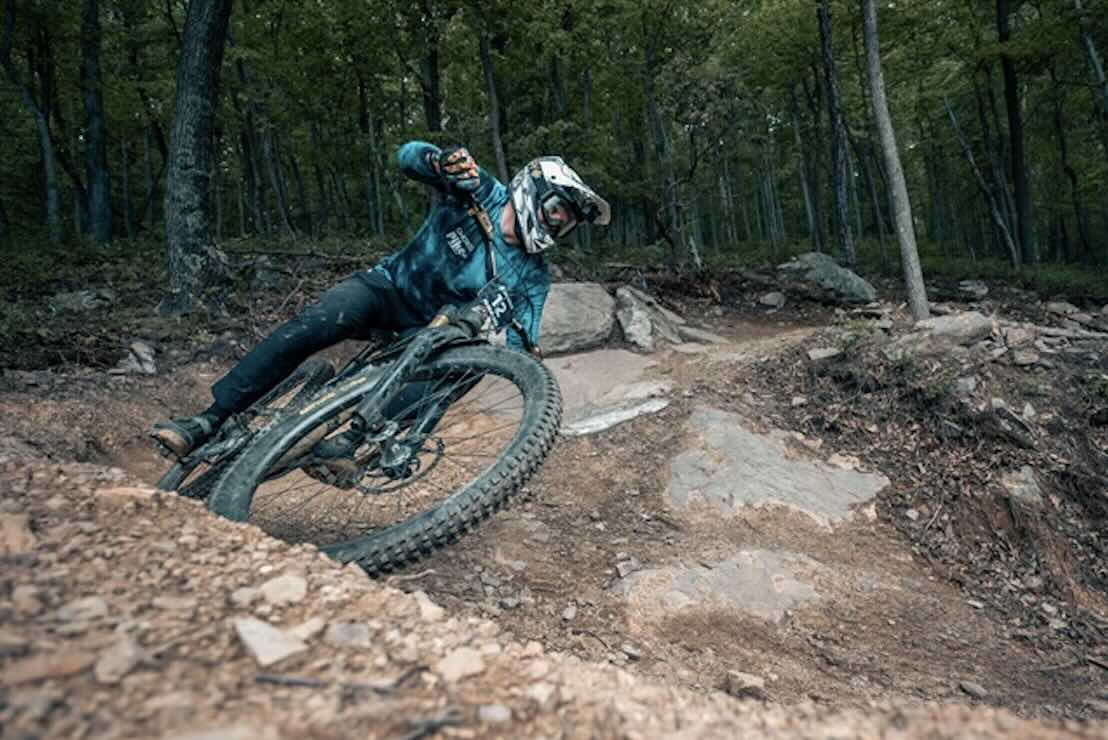 mountain biking racing down trail in West virginia enduro series