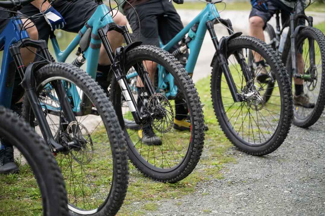 riders getting ready for mountain bike group ride